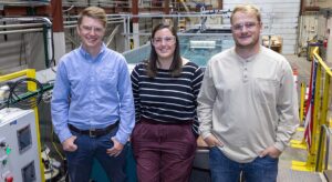 From left, NREL Research Engineer Charles Cando, University of Washington graduate student Brittany Lydon, and NREL Research Technician Kyle Swartz finish their wave tank tests for the University of Washingtons oscillating surge wave energy converter device at NRELs Flatirons Campus. Photo by Gregory Cooper, NREL