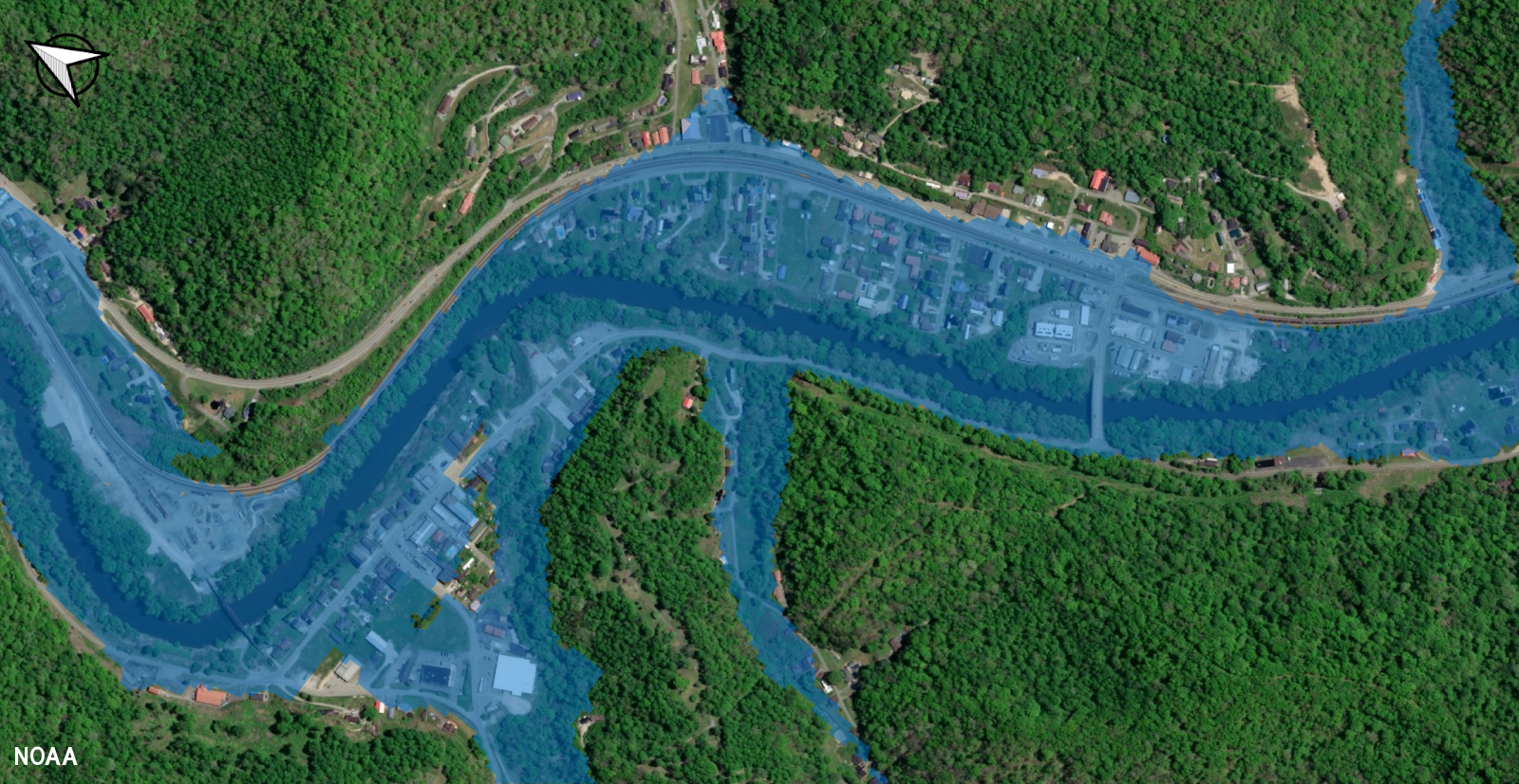 An example of NOAA's Flood Inundation Mapping (FIM) services: This is a simulated image of potential flooding over Warfield, Kentucky, along the Tug Fork River in February 2025. The blue represents forecast extent of inundation and extends away from the river channel to indicate numerous structures and streets may be affected by flood waters. Local emergency teams used those maps to deploy the National Guard with high-water vehicles to affected neighborhoods where they evacuated all the residents before water entered their apartments. (Image credit: NOAA)
