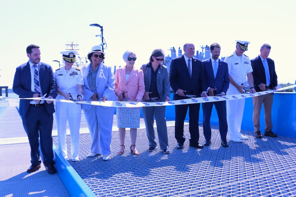 Commerce Department Deputy Secretary Paul Dabbar and NOAA Administrator Neil Jacobs, Ph.D., (fourth and third from the right, respectively) joined other leadership and partners to cut a celebratory ribbon draped across the entrance to NOAA’s newest pier and port facility in Charleston, South Carolina, July 8, 2026. (Image credit: NOAA)